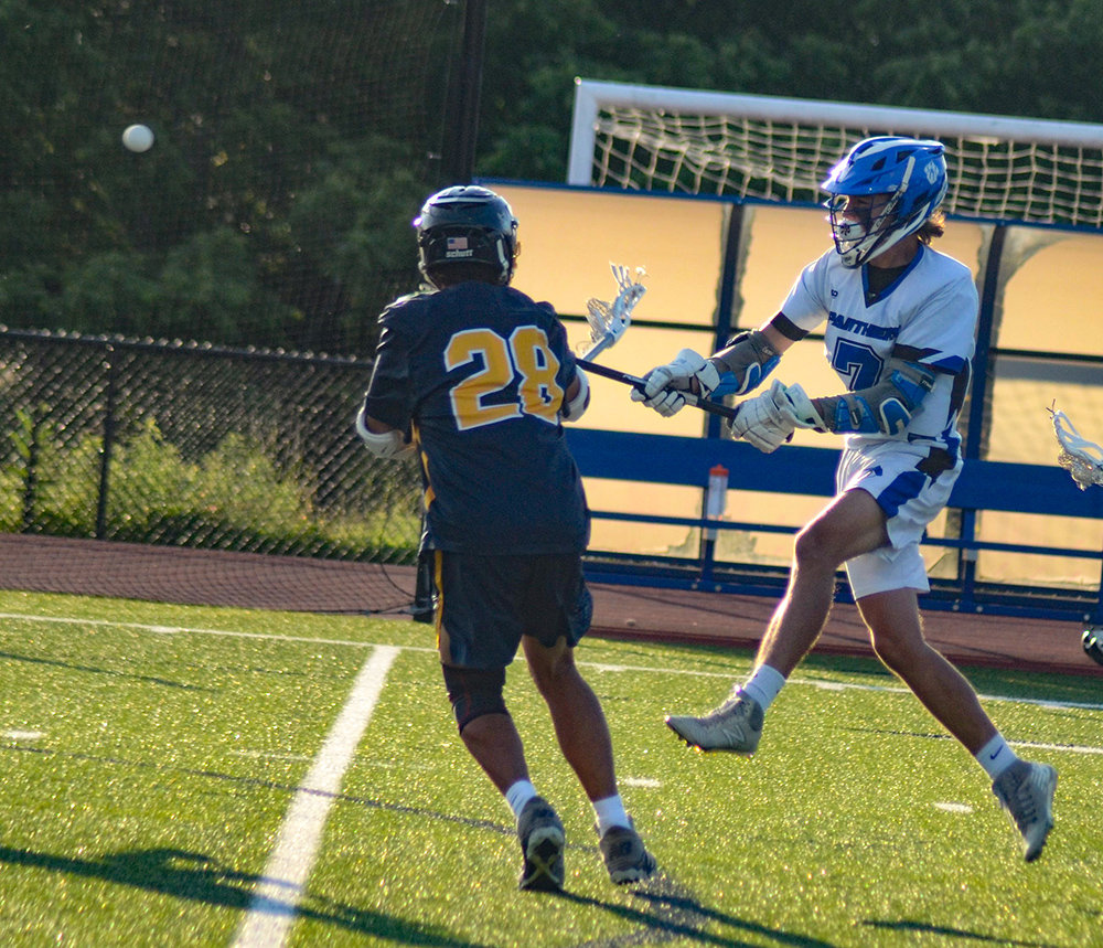 Wallkill’s Chad Castle shoots the ball as Highland’s Alexander Martinez defends during a Section 9 Class C boys’ lacrosse championship game at Wallkill High School, June 11.